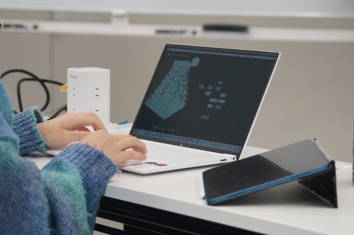 A student working with Nodi during the workshop